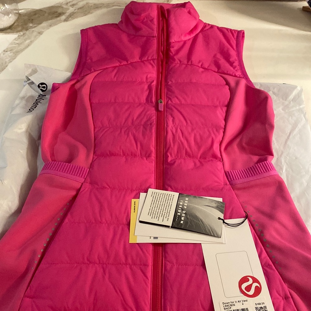 Lulu lemon down for it all VEST.  Hot pink.  So cute!